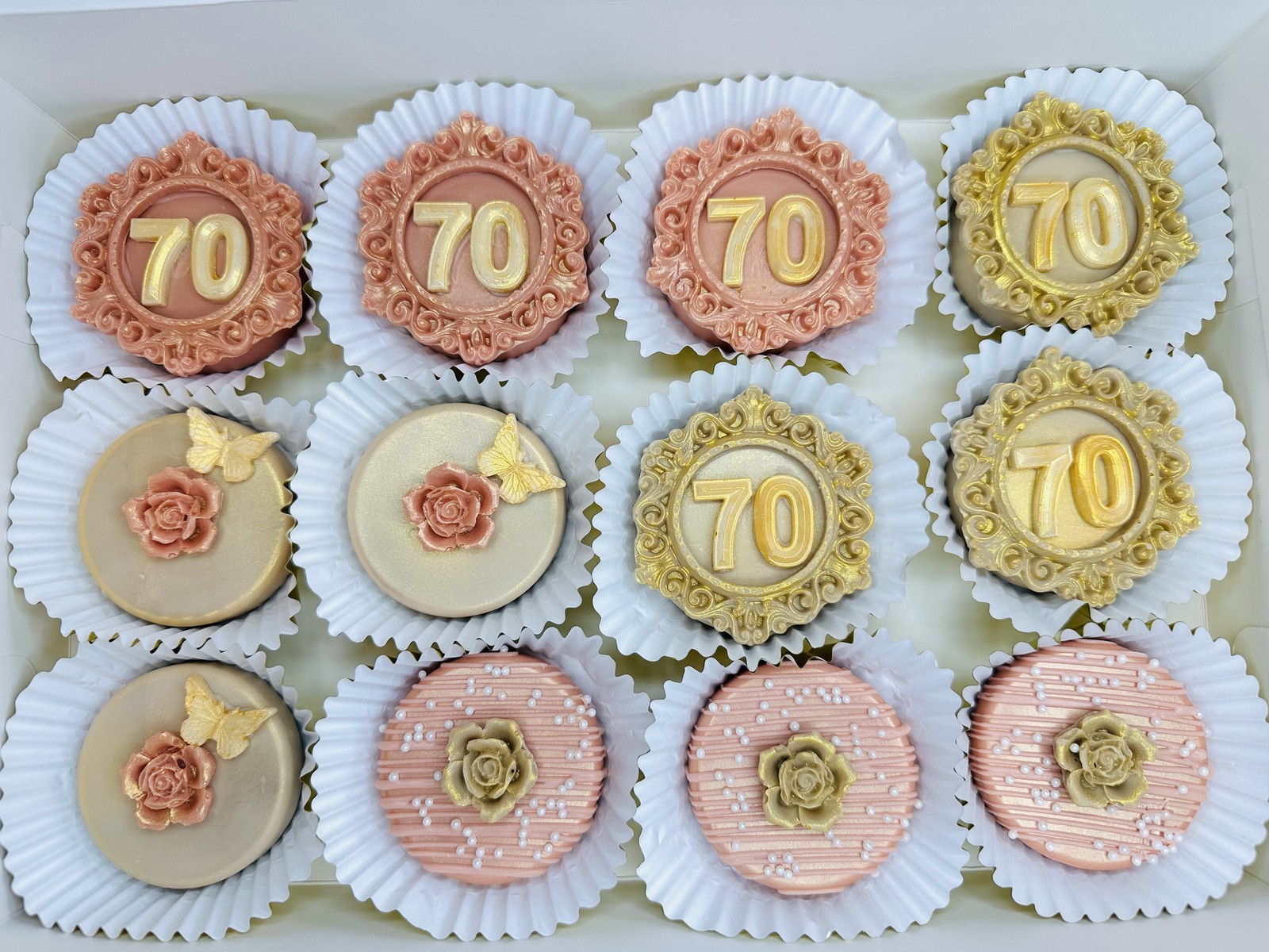 Elegant blush and gold 70th birthday chocolate covered Oreos