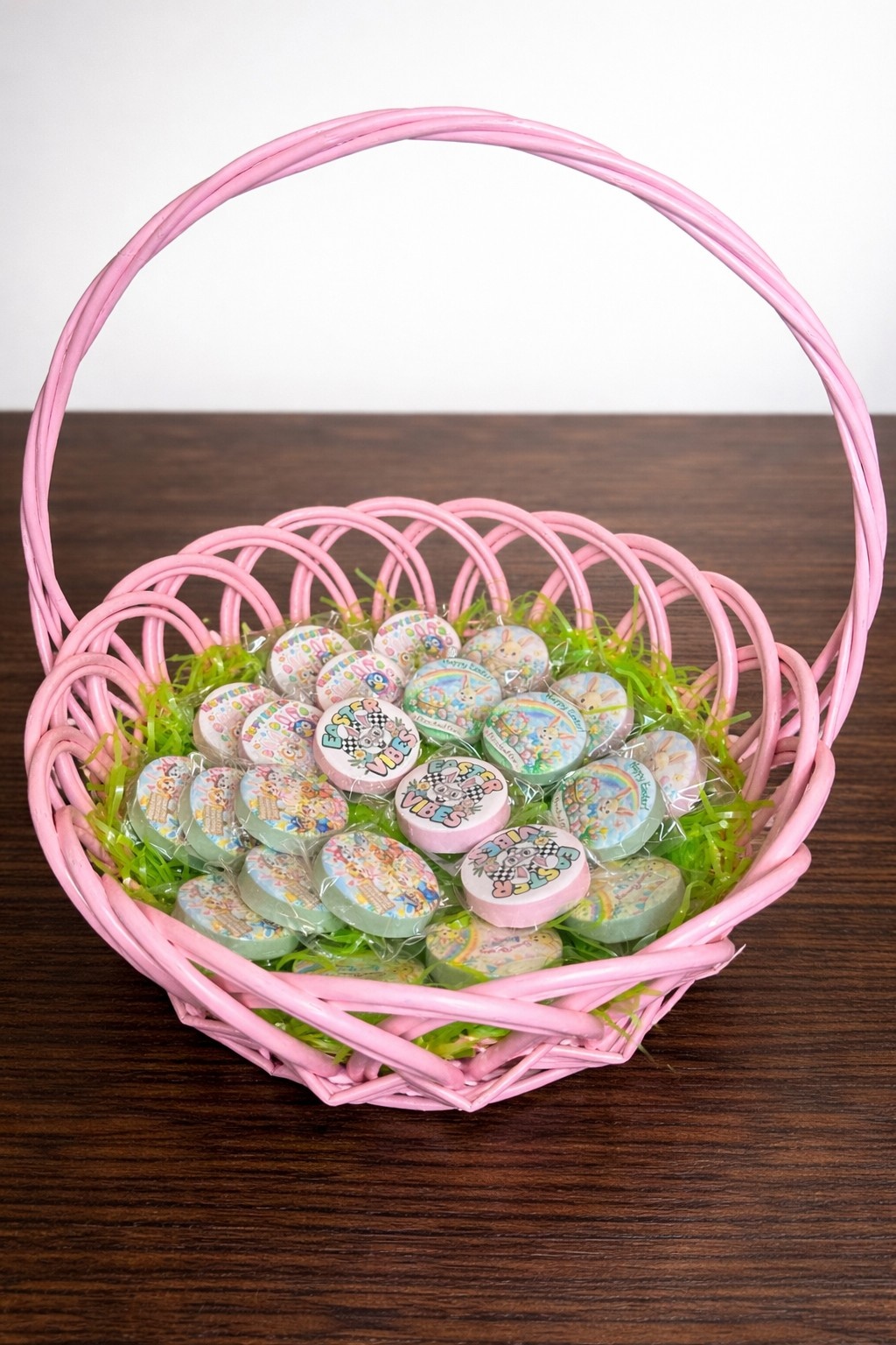 Easter chocolate covered Oreos arranged in a pink basket