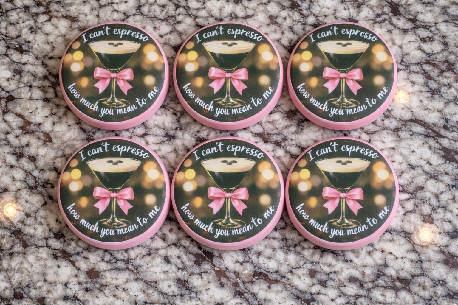 Espresso themed chocolate covered Oreos with pink bows