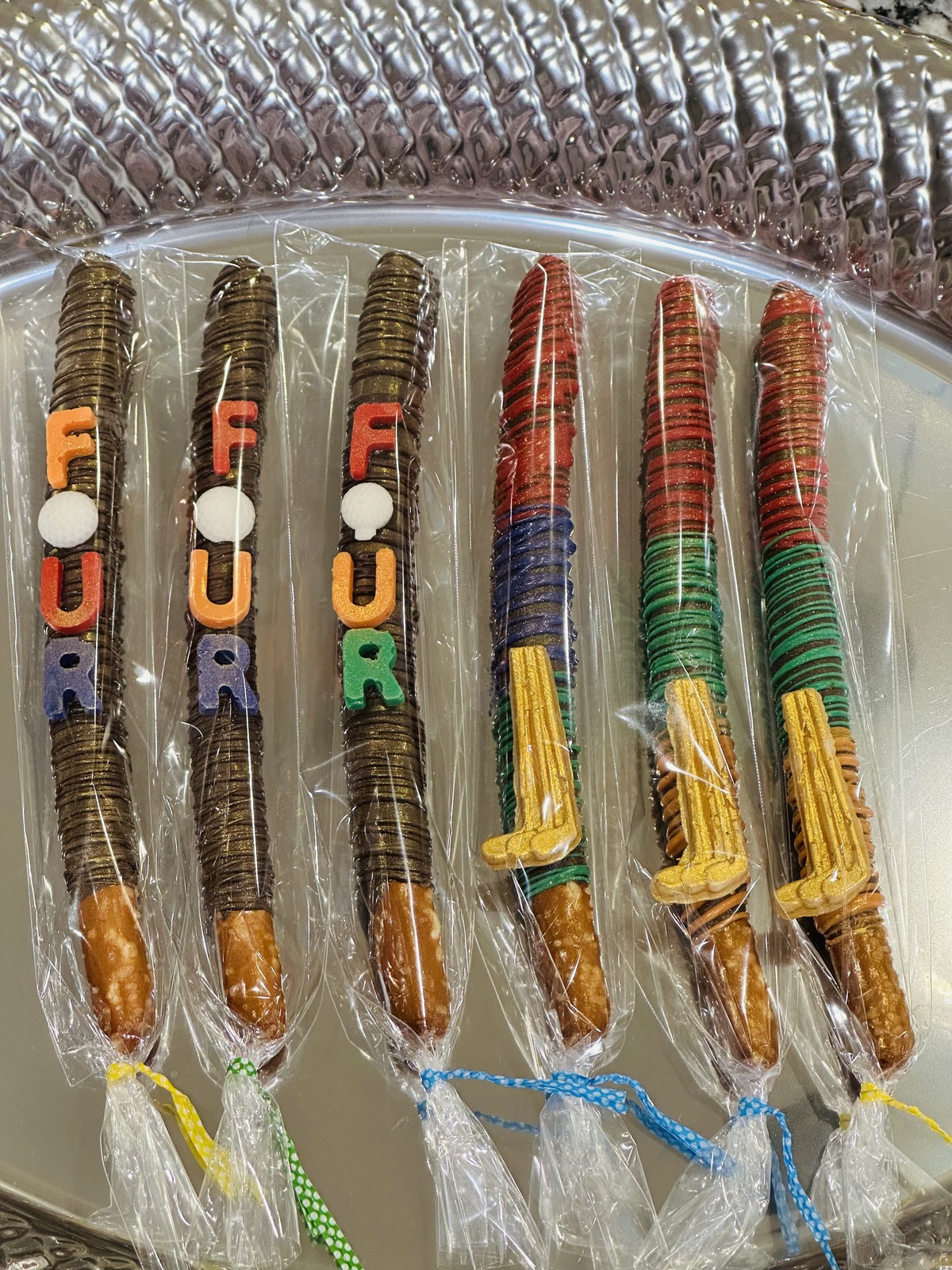 Colorful personalized chocolate covered pretzels with letter decorations