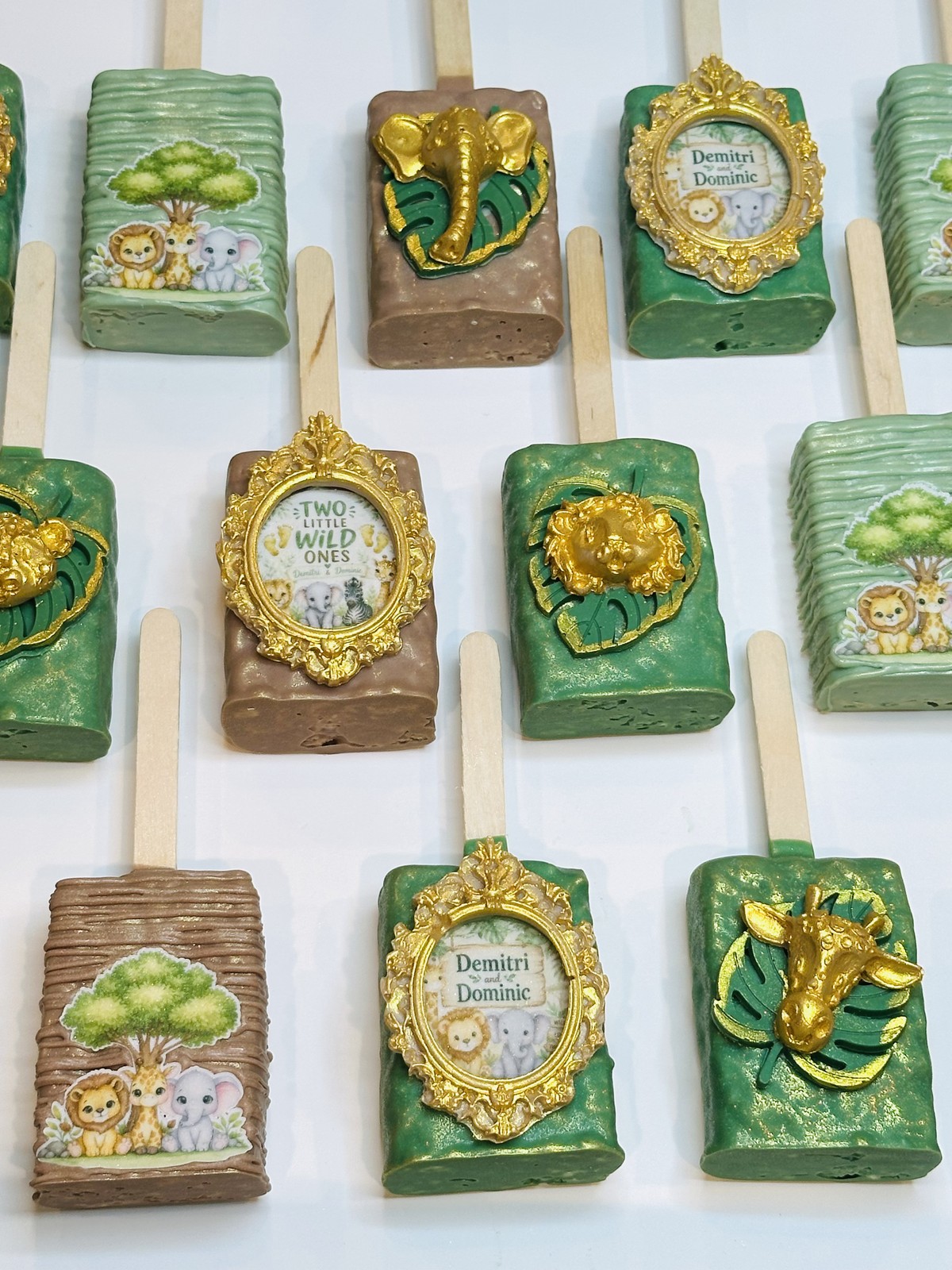 St. Louis themed red, royal blue, taupe, and gold chocolate covered Rice Krispie treat collection with framed local designs