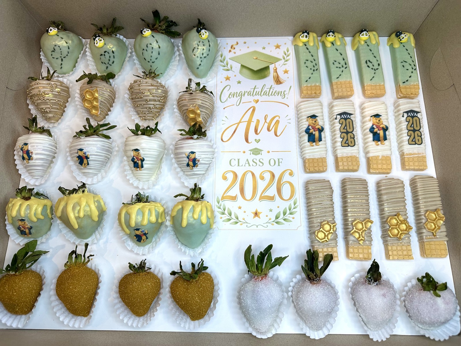 Elegant sage, ivory, and gold chocolate covered strawberries for a graduation celebration